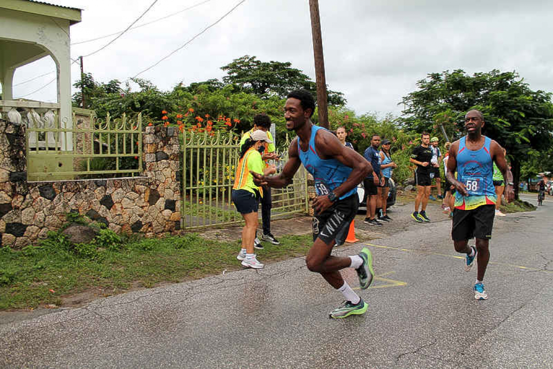 SXtreme Runners win rain-soaked 33rd Around-the-Island-Relay-Race